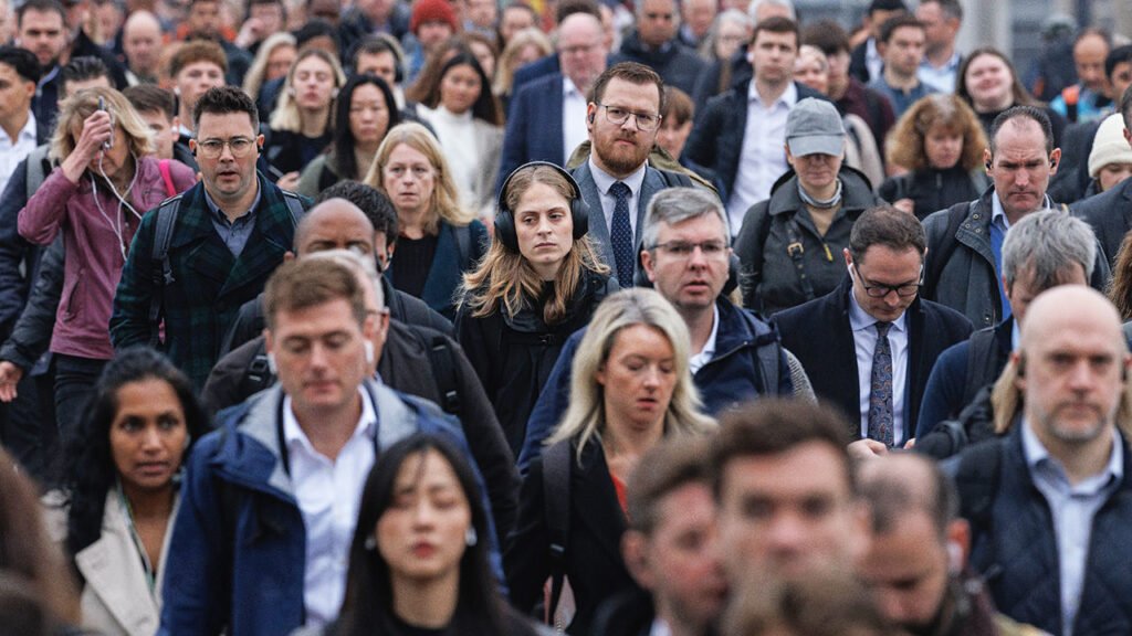 Commuters crossing London Bridge, United Kingdom.