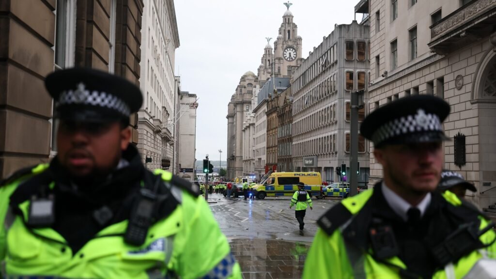 Car plows into Liverpool FC Premier League parade, injuring fans : NPR