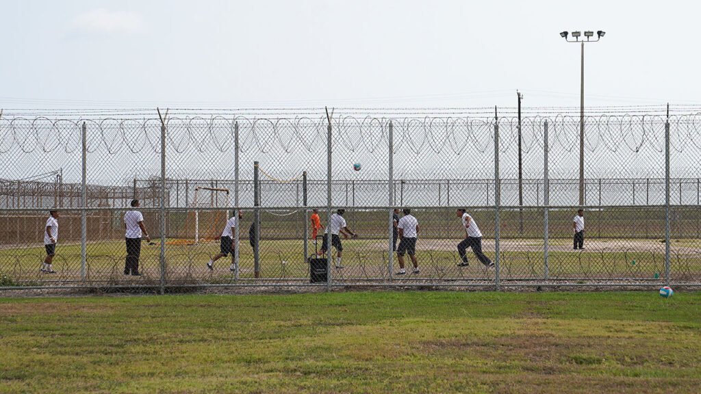 Detainees play outside at the Port Isabel Detention Center hosted by U.S. Immigration and Customs Enforcement, Harlingen Enforcement and Removal Operations in Texas.