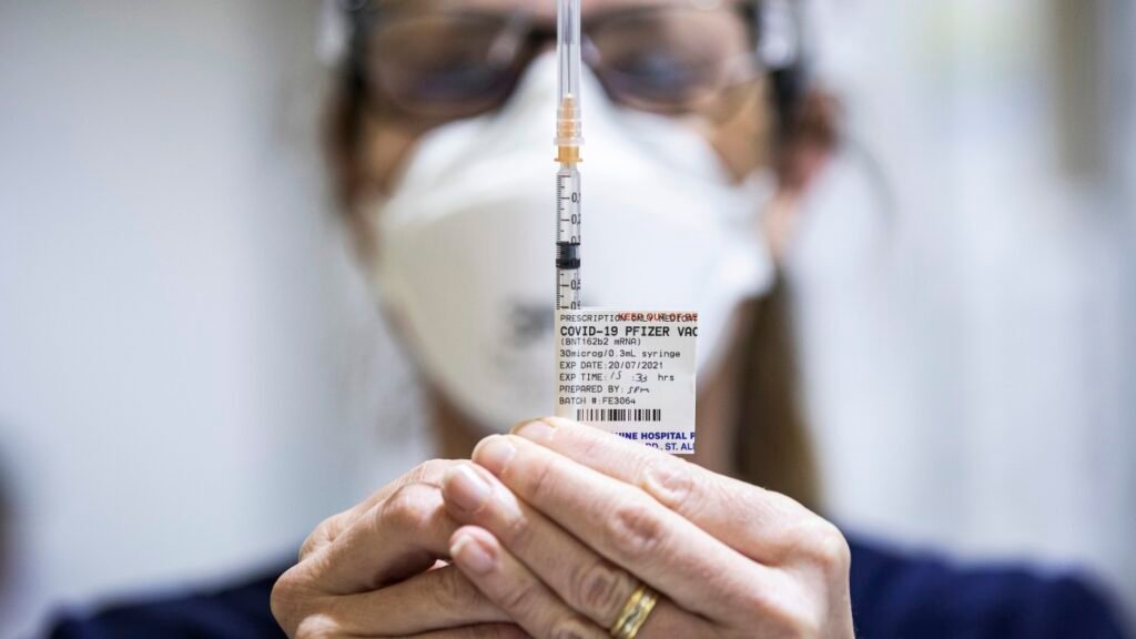 Gaza aid distribution; COVID vaccine guidelines : NPR