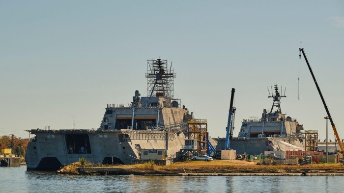 Australian shipbuilder says it would be ‘strange’ if government approves Korean takeover The ships are surrounded by cranes and scaffolding, with a clear sky in the background