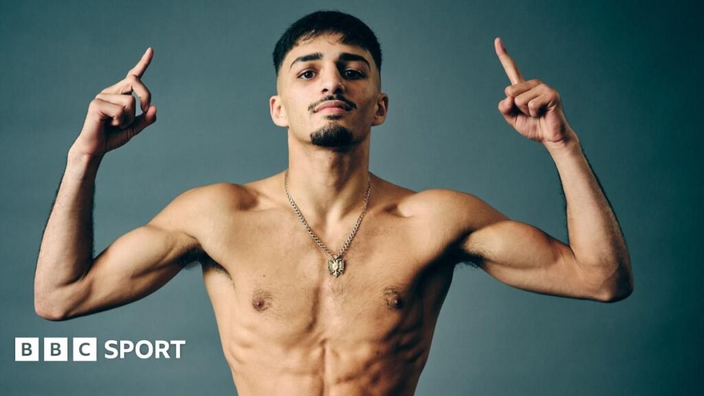 Adam Maca poses for pictures