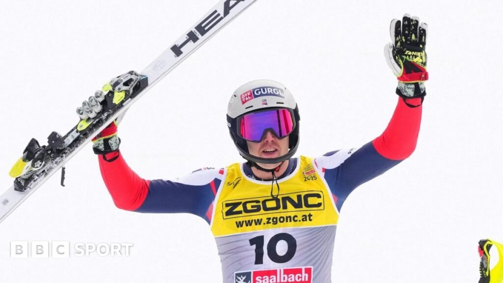 Dave Ryding holds his World Cup trophy in Kitzbuhel in 2022