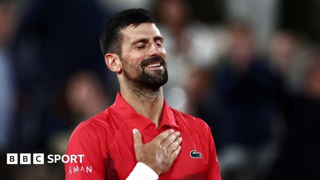 Novak Djokovic holds his heart after beating Alexander Zverev in the French Open quarter-finals