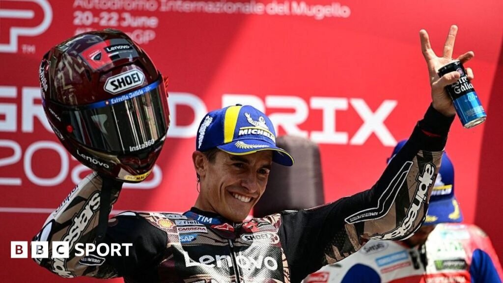 Marc Marquez raises his hand in celebration
