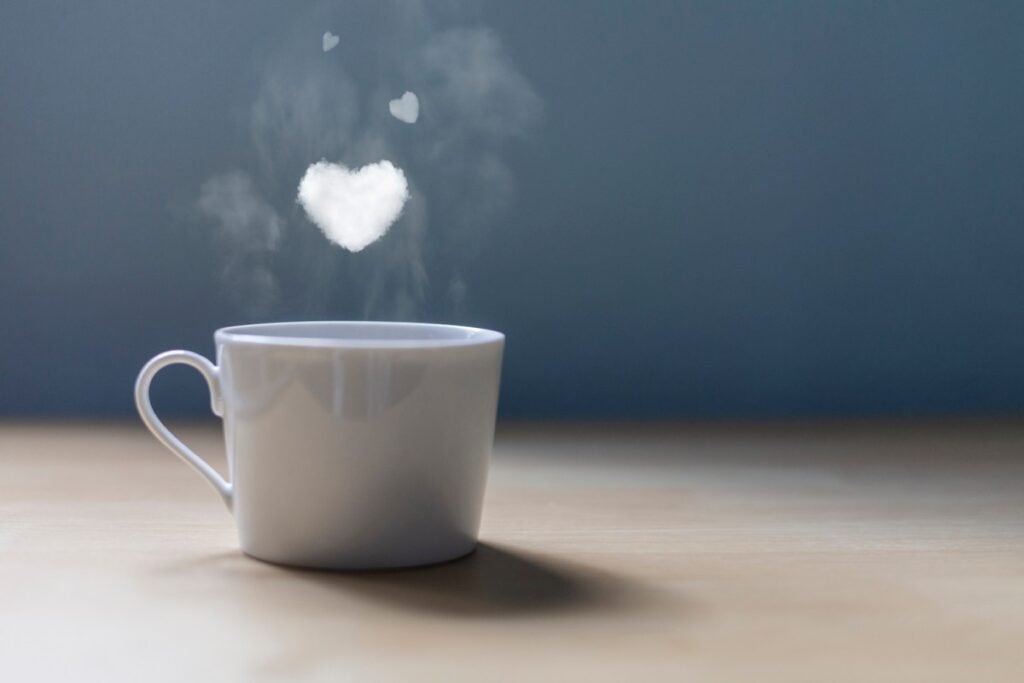 A cup of coffee with a lot of love. Conceptual photography Hearts of smoke come out of a cup of coffee.