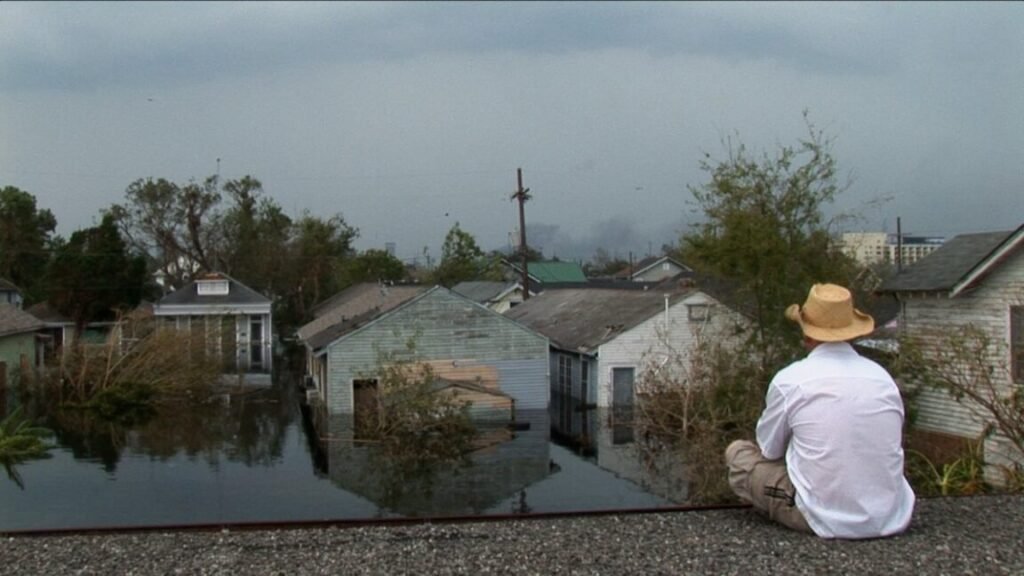 A man is stranded on a rooftop in the aftermath of Hurricane Katrina in 2005.