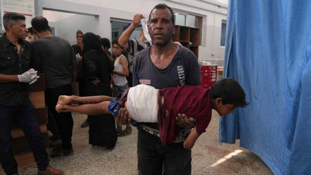 74 dead in Gaza as Israel strikes a cafe, shoots aid seekers : NPR