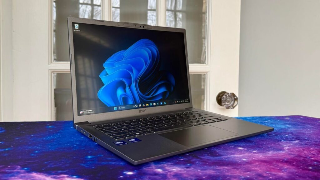 Acer Aspire 14 AI laptop in front of a door