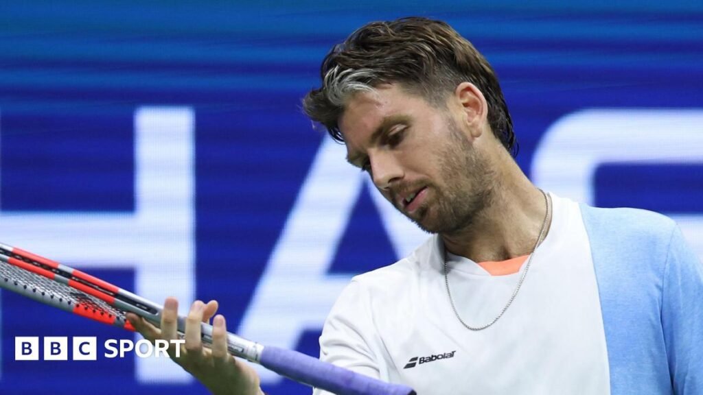 US Open 2025: Cameron Norrie loses again to Novak Djokovic as Serb great reaches last 16 Cameron Norrie looks at his racquet during a 2025 US Open defeat by Novak Djokovic