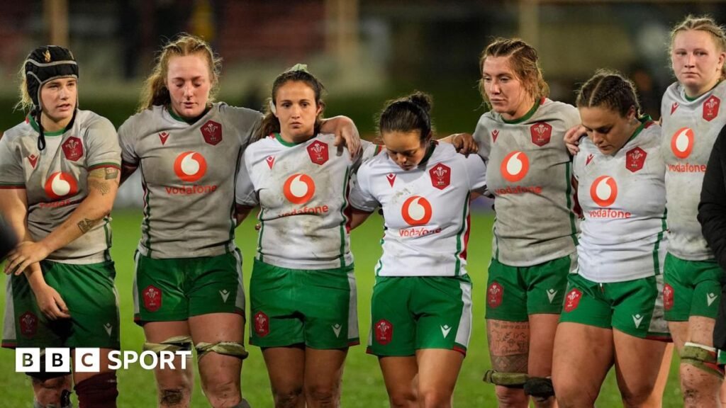 Wales players look dejected in defeat