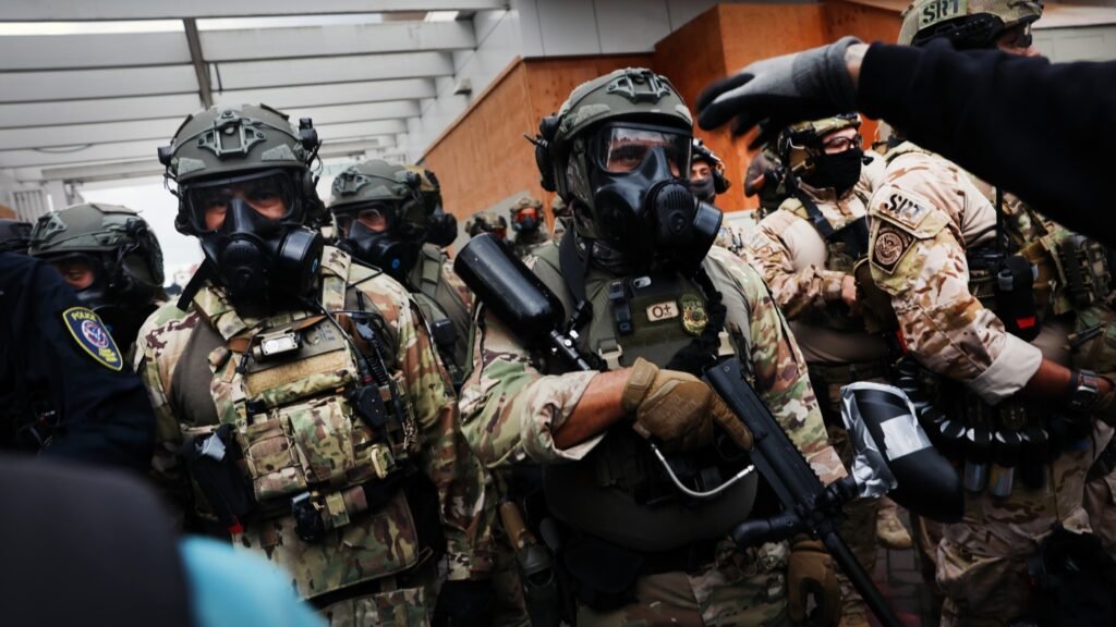 Trump federalizes the National Guard in Chicago, while troops arrive in Oregon : NPR